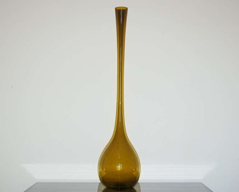 Designed by Arthur Percy for the Swedish glass maker Gullaskruf, an extra tall vase in butterscotch. These came in a number of different colors and sizes, this being the very largest. Produced from the early 1950s-1965s.

Measures: The vase