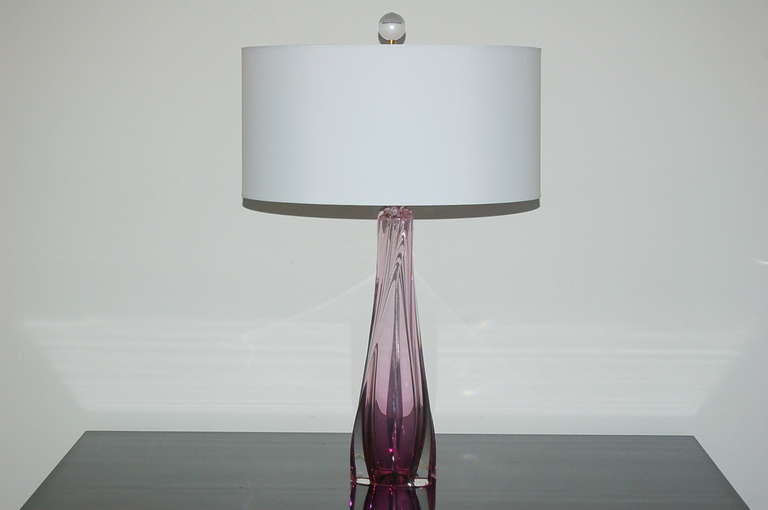 A layer of thick CLEAR Murano glass surrounding a core of BOYSENBERRY glass.  Very heavy, substantial pieces with whimsical fins and parabolic curves. 

The lamps stand 21 inches from tabletop to socket top. As shown, the top of shade is 26 inches