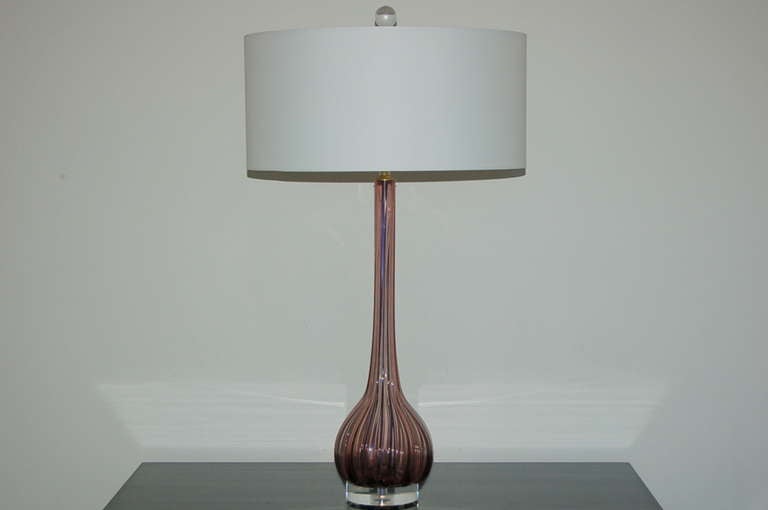 Such a divinely simple shape - subtly ribbed and long necked.  Vintage Murano lamps in a rarely seen BOYSENBERRY color, mounted on double lucite base. 

They stand 28 inches from tabletop to socket top.  As shown, the top of shade is 34 inches