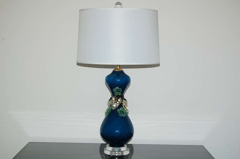 Such whimsy and style in MOODY MIDNIGHT BLUE with glass fruit applied at the midsection, like a corsage on prom dress. These vintage Murano lamps are mounted on a simple Lucite base and have been completely rebuilt with solid brass hardware.

The