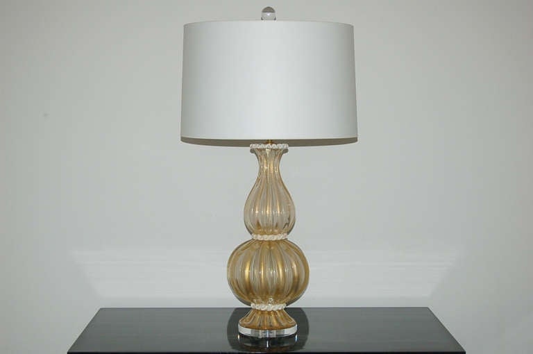 Multi-tiered layers of GOLDEN CHAMPAGNE glass accented by WHITE rigaree glass piping.  The glass is heavily infused with inclusions of GOLD. Elegant and stylish.

The lamps stand 25 inches from tabletop to socket top. As shown, the top of shade is