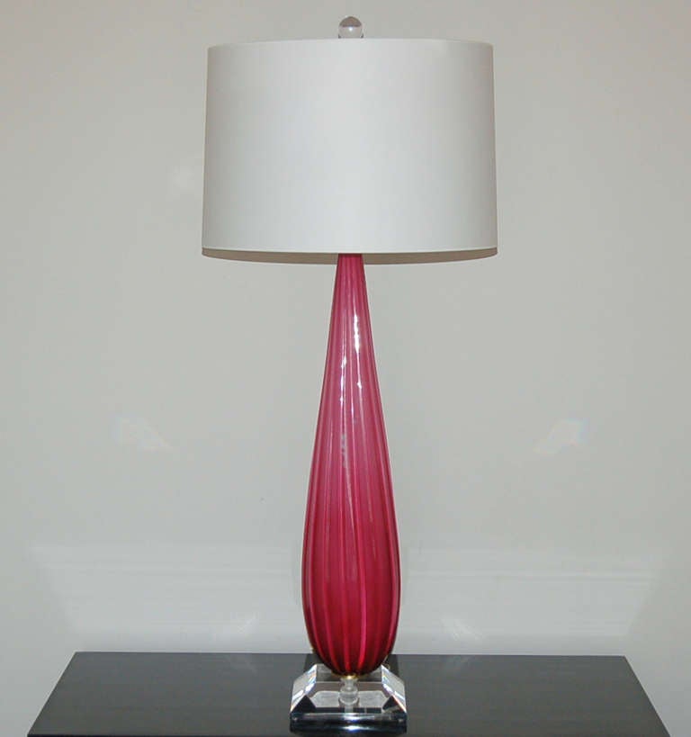 Like Jayne Mansfield, these lamps are voluptuous and sexy. A powerful LIPSTICK PINK, floating on Lucite - a spectacular pair!

The lamps stand 32 inches from tabletop to socket top. As shown, the top of shade is 40 inches high. Lampshades are for