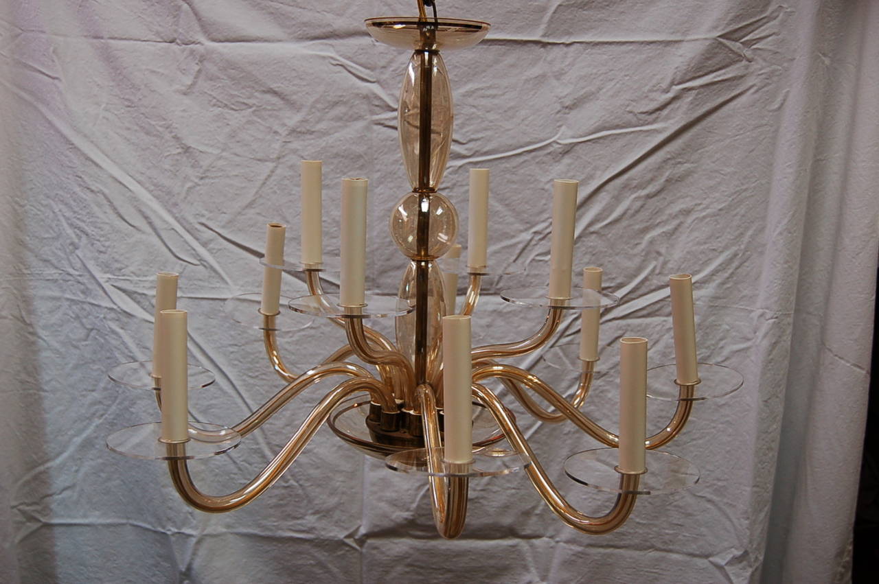 Elegant vintage Italian Venetian two-tiered chandelier in CHAMPAGNE, with hand-painted gold rimmed accents. There are eight arms on the lower level, four arms on the upper. The bobeches are clear Lucite.

The chandelier is 26 inches across,