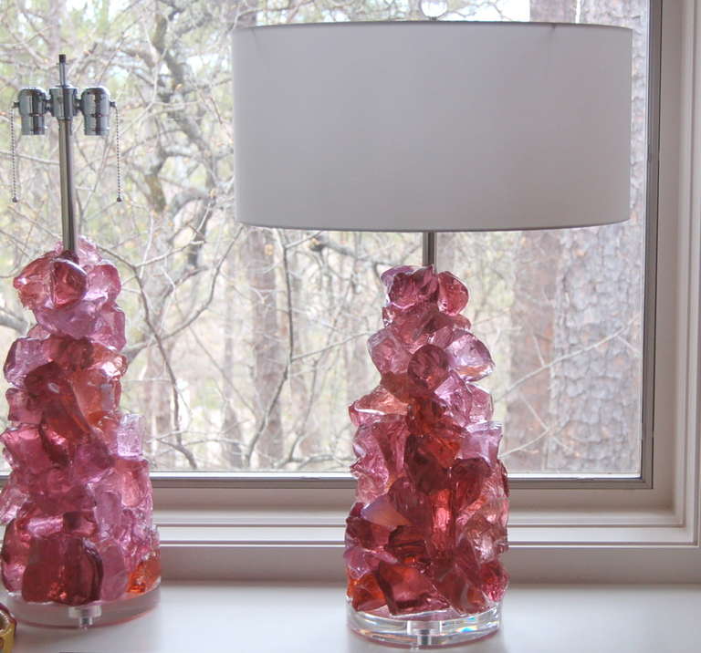These beautiful cluster lamps in ORCHID ROSE are made of 100% recycled glass. Gorgeous eco-friendly art pieces that really light up a room, designed by Swank Lighting.

The lamps are based on Lucite bases and built with nickel hardware. They measure