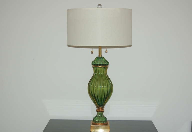 Matched pair of elegant Murano lamps in EMERALD GREEN. The Marbro Lamp Company imported these lamps from Italy in four different colors - a matched pair of green is one of the more sought after!

The lamps stand 39 inches tall to the top of their