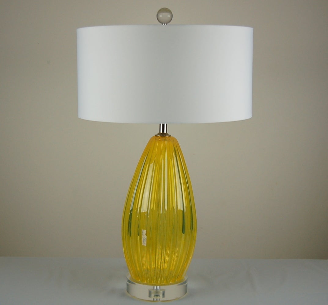 These LEMONADE yellow Murano lamps were handblown in the 1960s by Archimede Seguso. When the sun hits the glass, they look like they are on fire, they really glow! 

The lamps measure 21 inches to the socket top. As shown, the top of shade is 26