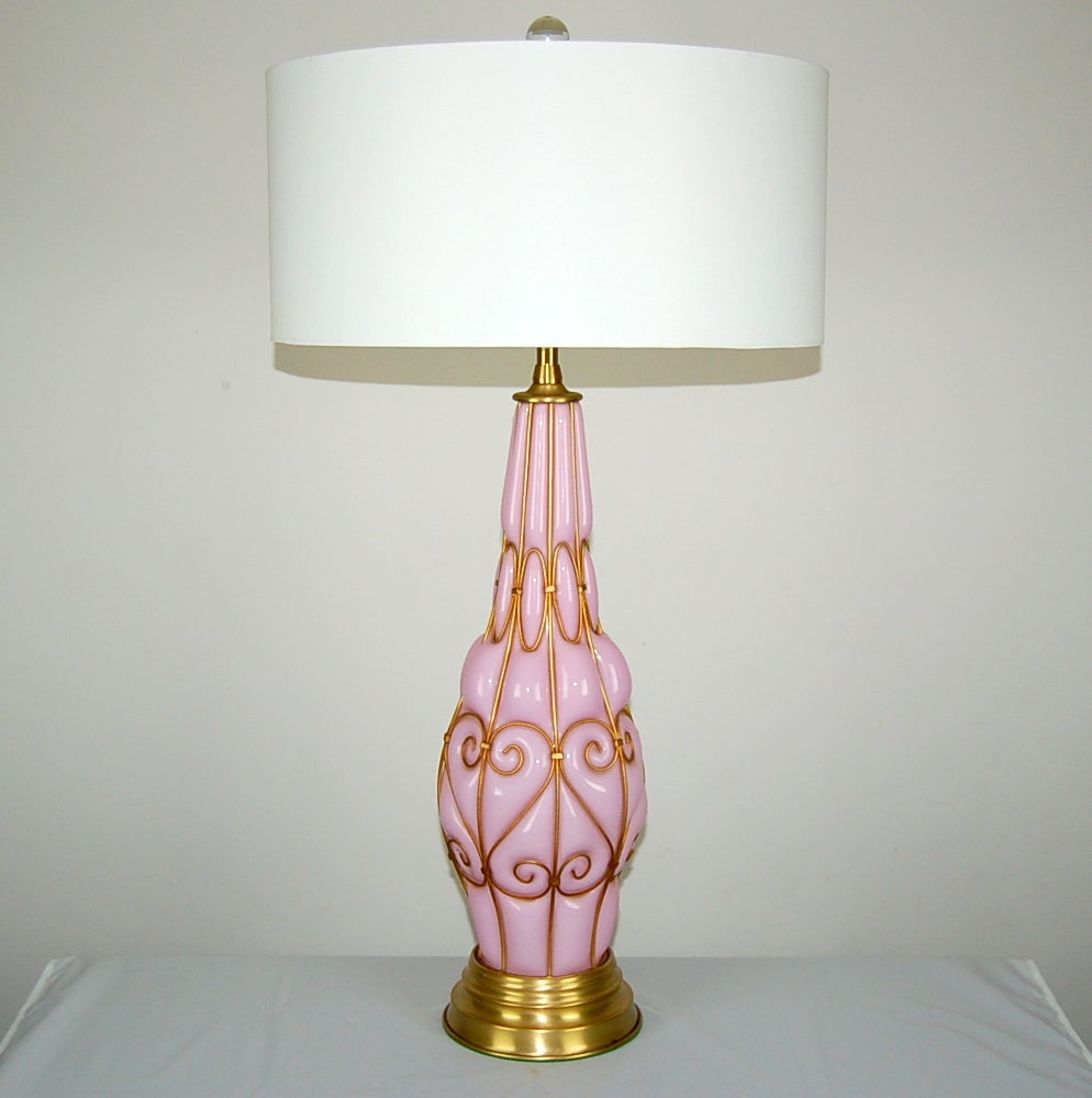 Caged lamps in COTTON CANDY PINK, by the Marbro Lamp Company. The glass and brass are perfect, as if they have been in a vault for the last fifty years!

They stand 30 inches from tablets to socket top. As shown, the top of shade is 35 inches