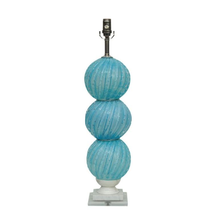 Vintage Murano stacked ball table lamp mounted on Italian marble base. The soft sky blue glass is filled with hundreds of bubbles, with nickel wafers between each ball.

Measure: The lamp stands 28 inches from tabletop to socket top. As shown, the
