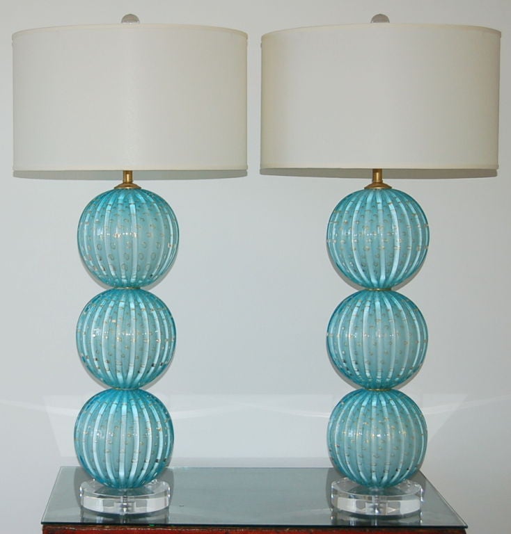 Such a wonderful soft blue - the same blue Barovier & Toso used for their high end line back in the 1950s.  These stacked ball Murano lamps are filled with loads of gold dust and controlled bubbles.  

The lamps measure 31 inches to the top of the