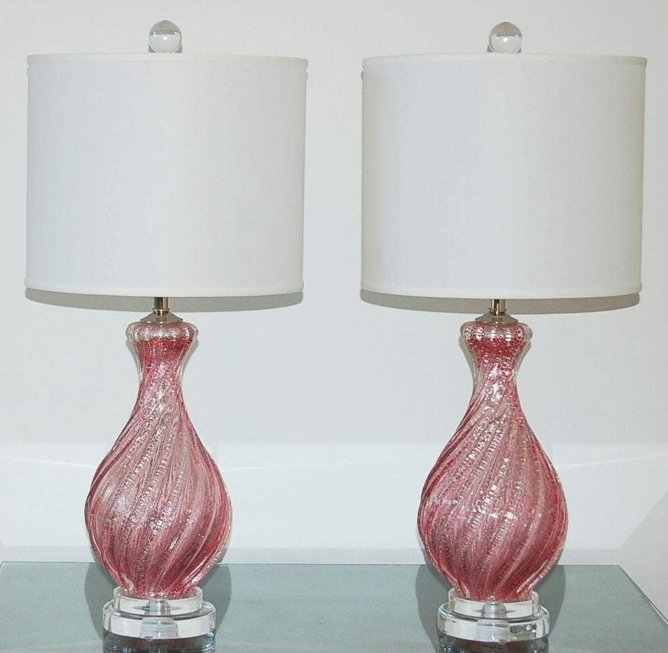 For a more formal look, consider this pair of vintage Murano lamps in ROSEY PINK. This classic design from the 1940s has curves and prominent ribs and is filled with silver foil.  The Pulegoso in the glass adds depth.

The lamps stand 20 inches