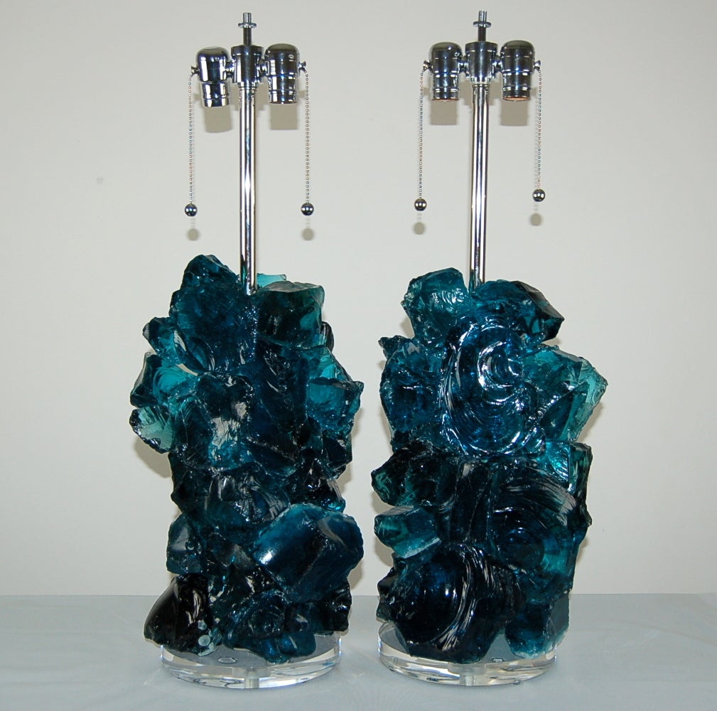 Our last pair of exquisite cluster lamps in TEAL BLUE - made of recycled glass. Gorgeous eco-friendly art pieces that really light up a room, designed by Swank Lighting. The color is mesmerizing!

The lamps measure 27 inches to the top of the