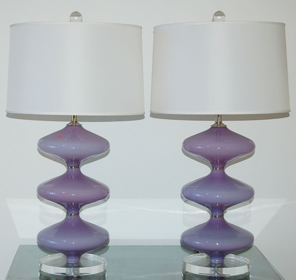 Exquisite double hourglass vintage Murano lamps in Lilac, imported in the 1960s. They are elegant, stylish and very sexy!

The lamps are 24 inches from tabletop to socket top and 8.5 inches at their widest. As shown, the top of shade is 30 inches
