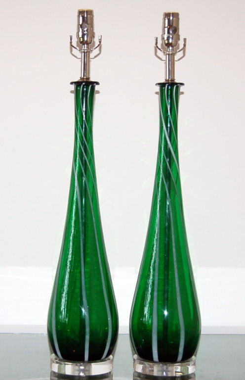 Our very last pair of these graceful teardrop Murano lamps in EMERALD GREEN with vertical stripes of white, c 1957.  Tall and slender with that Audrey Hepburn neck - very sleek and sexy!

They measure 28 inches from tabletop to socket top.  As