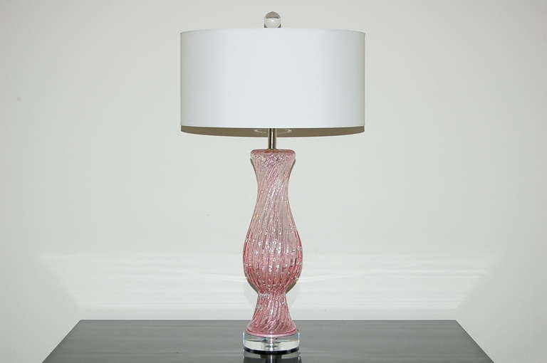 Slim silhouette and classic design. PALE PINK Murano lamps with inclusions of silver and loads of controlled bubbles. 

The lamps stand 24 inches from tabletop to socket top. As shown, the top of shade is 29 inches high. Lampshades are for display