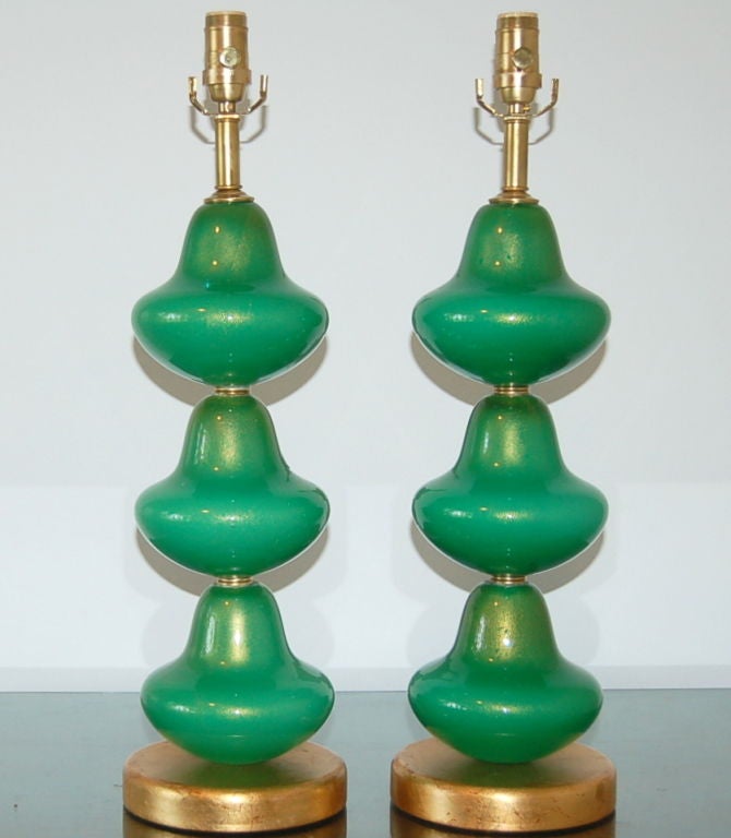 Stacked table lamps in vivid JADE GREEN.  Each glass piece is filled with 24KT gold dust, complemented by a gold leafed base and satin brass hardware.

These lamps are 24 inches from tabletop to socket top. As shown, they are 31 inches to the top