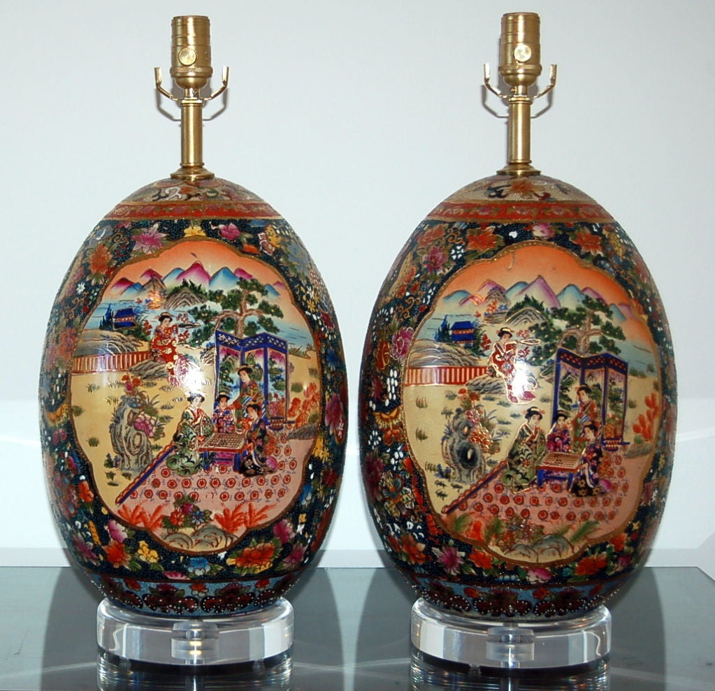 Simply divine Satsuma painted eggs, bold and colorful.  The egg shell is extremely thick, indicative of quality pottery.  Enlarge photos to see the intricate design and beaded work on each egg.

The lamps measure 22 inches to the socket top.  As