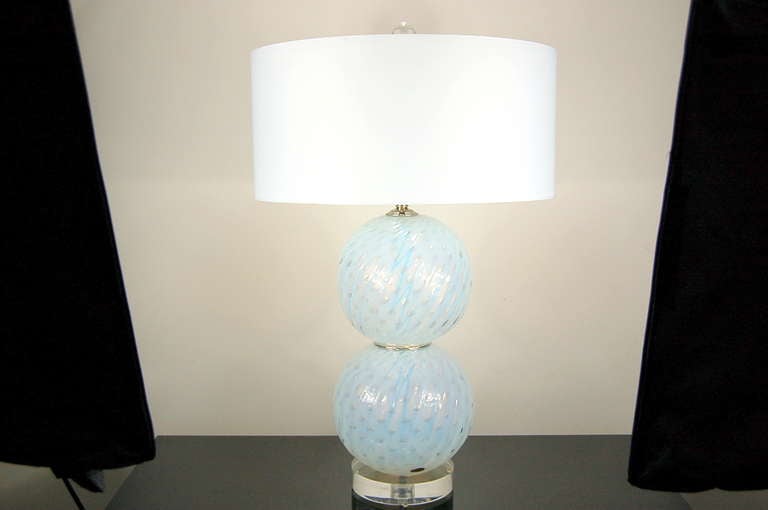 The beauty of WHITE OPALINE glass!  These lamps have that soft blue look to it, as you see in our photos. They are simply magical, with large controlled bubbles and diagonal ribs - these are a beautifully matched pair!

The lamps stand 25 inches