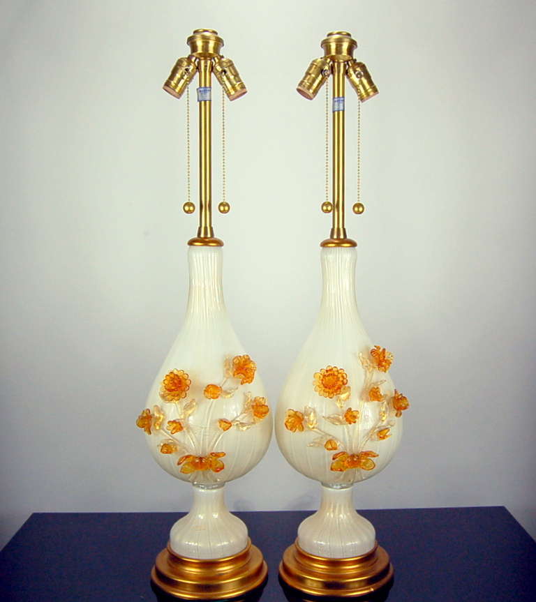 A glorious bouquet of glass flowers adorn these GOLD filled WHITE glass lamps, by The Marbro Lamp Company, 1950s. Every glass leaf and flower is perfect, as if time has never passed since these were created. 

The lamps stand 34 inches to the