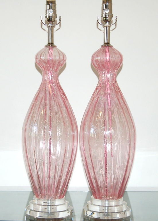 Translucent COTTON CANDY PINK Murano lamps with controlled bubbles and SILVER inclusion.  They are simply beautiful, and have a wonderful shimmering elegance to them.

The lamps measure 27 inches from tabletop to socket top.  As shown, the top of