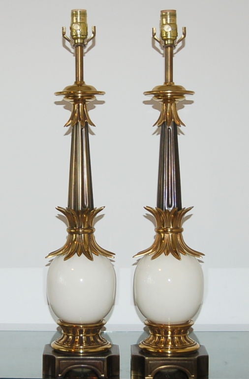 Mid-Century lamps with ceramic ostrich eggs complemented by brass and pewter colored accents. These are in such perfect condition, they show like brand new! Stiffel label on socket.

The lamps are 28 inches from tabletop to socket top. As shown,