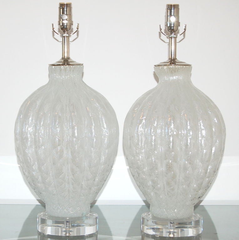 Luscious pair of White Ice vintage Murano lamps in netted pattern! with tiny air bubbles trapped within the glass, giving these lamps a frosty look.  They were blown by Galliano Ferro in the 1950s.  Original importer's label present.

They measure