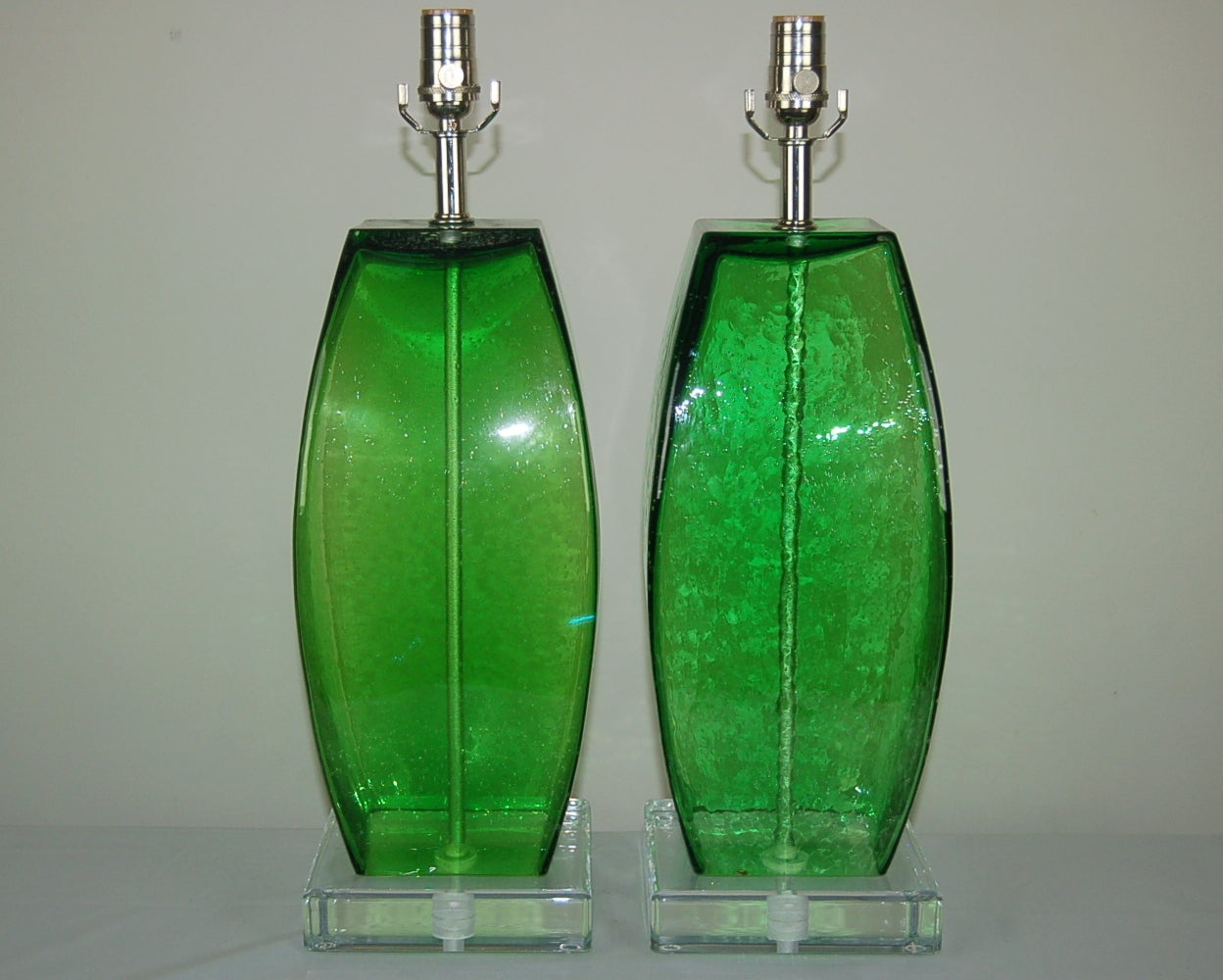 Pulegoso art glass lamps in GRASS GREEN.  They have loads of tiny air bubbles within and were hand blownin the 1970's.  

They stand 22 inches from tabletop to socket top. As shown, the top of shade is 28 inches tall. Lampshades are for display only