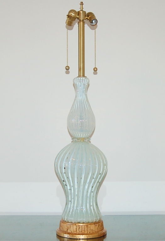 Stunning creamy WHITE OPALINE with controlled bubbles.  The two pieces of glass are separated by a clear wafer loaded with gold.  

The lamp measures 35 inches to the top of the sockets.  As shown, the top of shade is 36 inches high.  Lampshade is