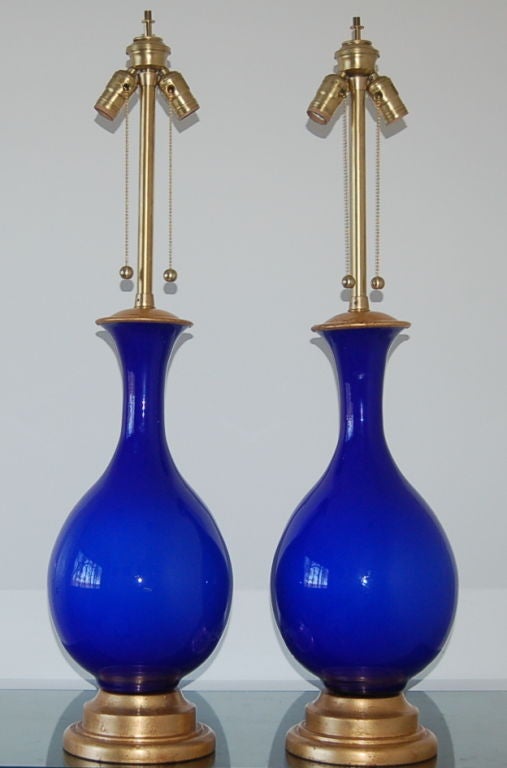 Intensely vivid Cobalt Blue Murano glass lamps from The Marbro Lamp Company.  This shade of blue is very rare for Murano glass - it's hard to find a matched pair as this in such perfect condition!

The lamps are 34 inches to the socket top.  As