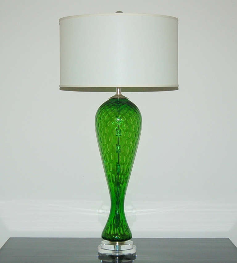 Towering, curvaceous Murano glass lamps in EMERALD GREEN, with windowpane optics. The color is bright and attention getting, making these lamps total jaw droppers!

They stand 30 inches from tabletop to socket top. As shown, the top of shade is 36