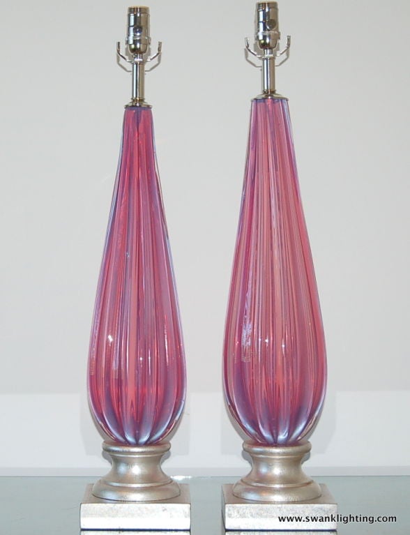 Rarest of the rare - a wonderfully intense LAVENDER PINK in a classic teardrop shape, heavily ribbed. We have these mounted on silver leafed bases, which are exquisite. 

The lamps measure 30 inches to the socket top. As shown, the top of the