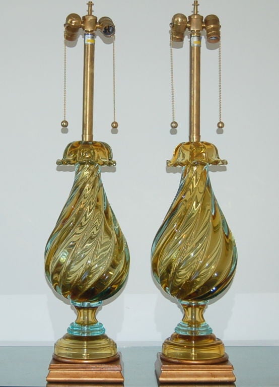 Matched pair of vintage Sommerso Murano lamps by The Marbro Lamp Company in deep CHAMPAGNE with AQUA accents. The glimmers of greens and blues appearing randomly provide real magic!

They stand 34 inches from tabletop to socket top. As shown, the