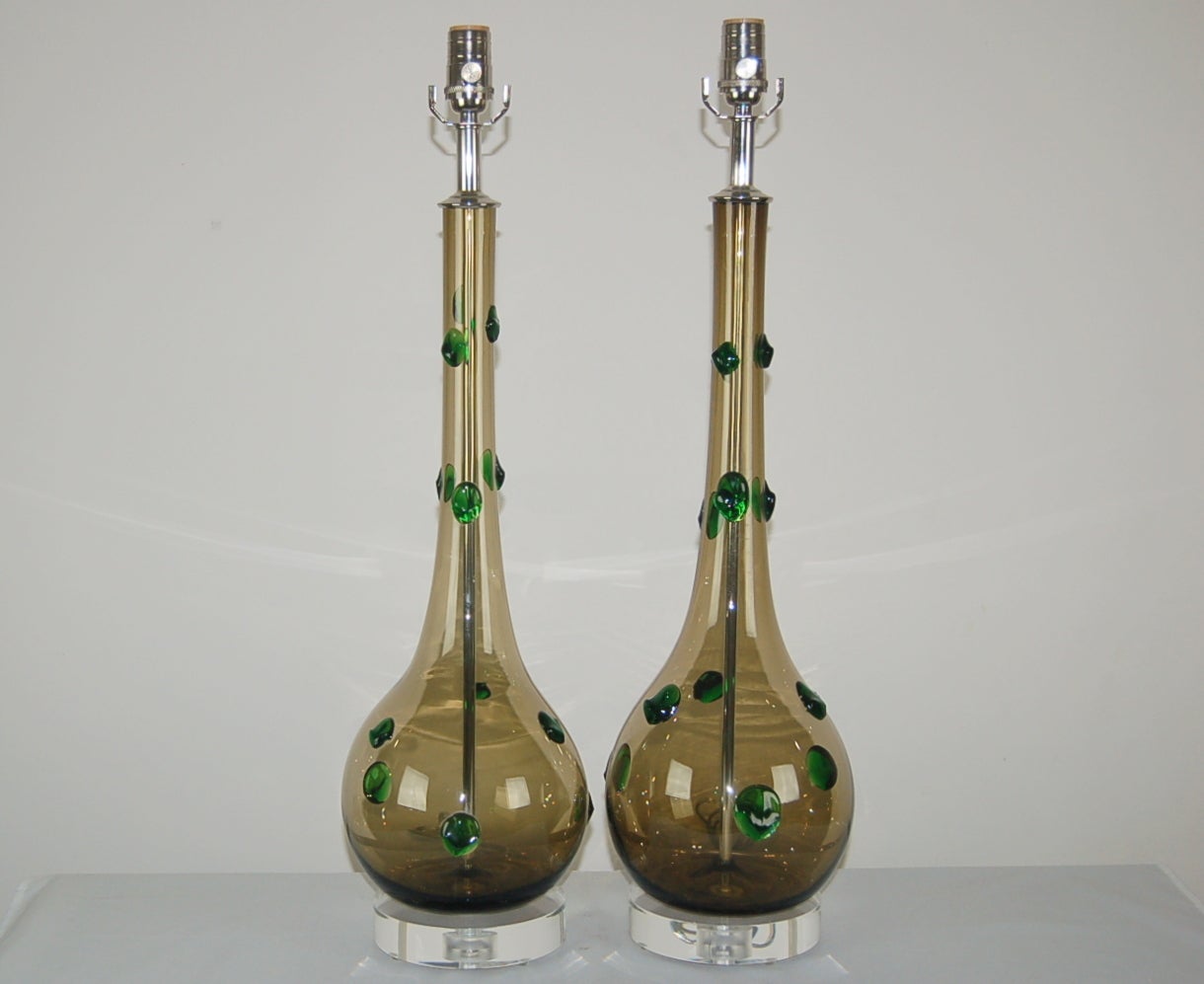 Matched pair of vintage Murano table lamps. A very elegant pair of vintage Murano lamps in SMOKEY BRONZE with prunts of EMERALD GREEN. These are a beautifully matched pair. 

They stand 28 inches from tabletop to socket top. As shown, the top of