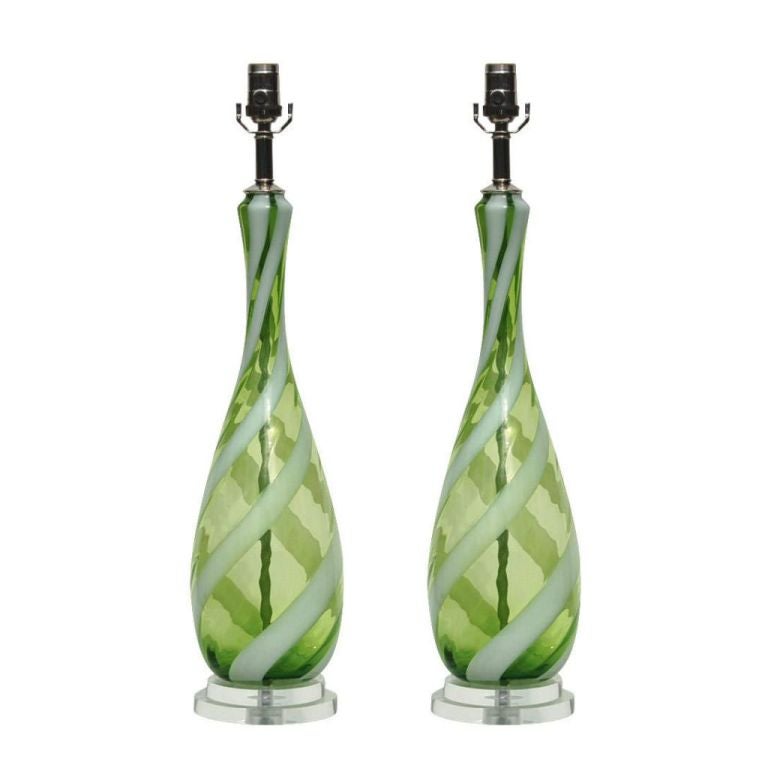 Truly vibrant!  These lamps are a very intense APPLE GREEN with a swirling ribbon of WHITE. The white stripe really pops against the green - the polished nickel hardware adds a touch of elegance!  This is a perfectly matched pair in a really rare