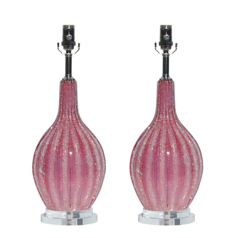 Imagine freezing some Frambois until it's nice and icy.  Now you know what these lamps look like.  Such a beautiful, frosty RASPBERRY ICE color.  Vertical ribs give it a striped look.

The lamps measure 21 inches to the socket top.  As shown, the