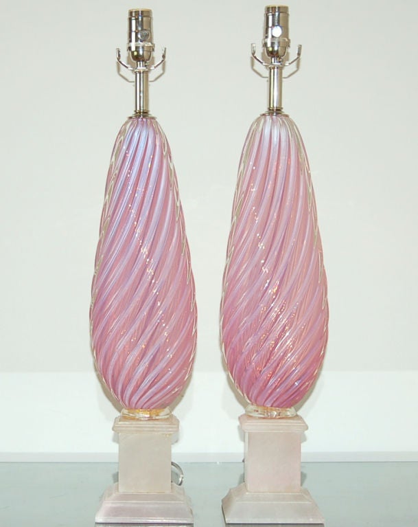 The color of these lamps is extraordinary, thanks to the opaline blown into the glass. It is a very vibrant PINK LEMONADE with lavender highlights. 

The lamps measure 27 inches from tabletop to socket top. As shown, the top of shade is 33 inches