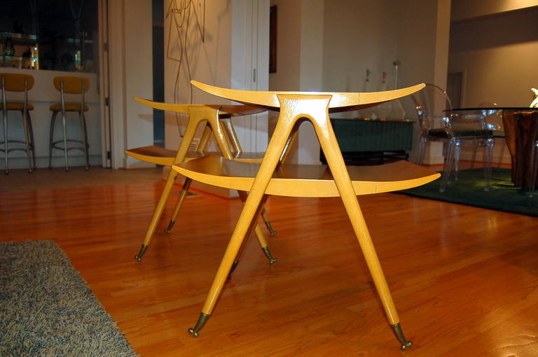 Stylish, sexy blonde Italian side tables with rarely seen double-knuckle sabots, attributed to Ico Parisi or Gio Ponti.  Matching coffee table also available for sale.

These tables measure 26 inches high, 26 inches wide, and 18 inches deep.