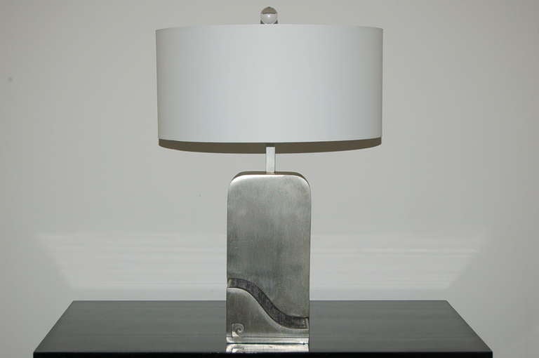 Gotta love the 1970s! Stainless steel capsule lamps by Pierre Cardin, totally rebuilt and ready for a sleek, sophisticated home.

Measures: They stand 22 inches from tabletop to socket top. As shown, the top of shade is 28 inches high. Lampshades