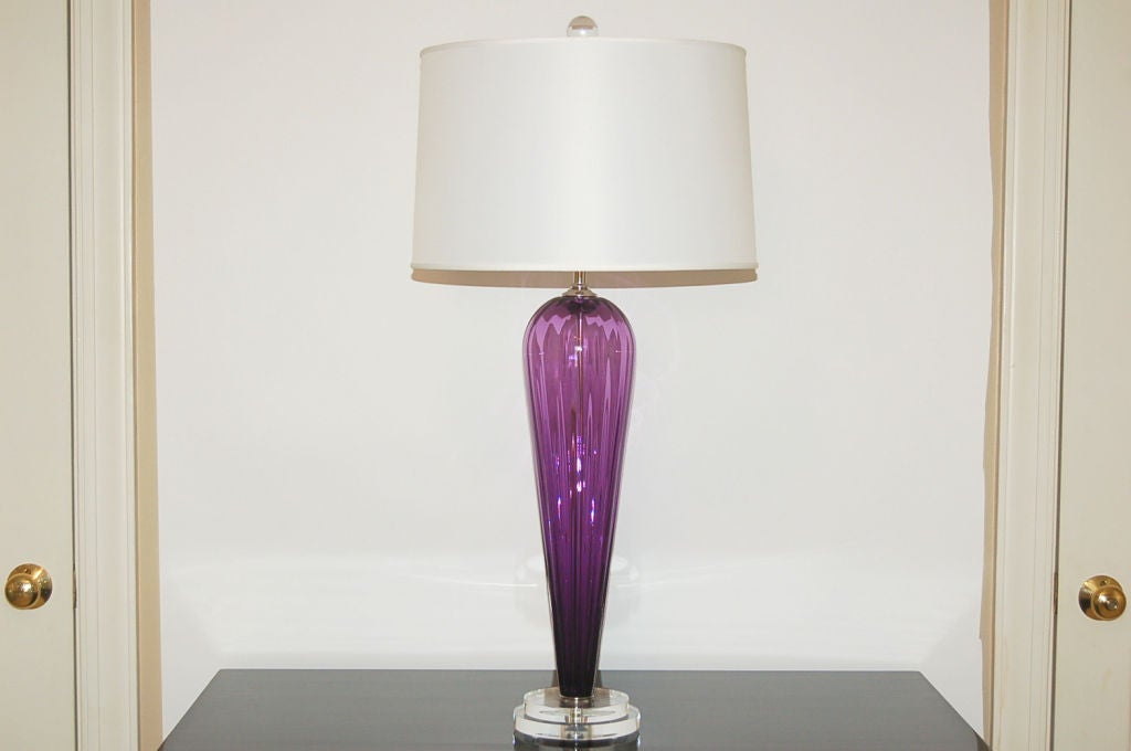 Exclusively blown for Swank Lighting by California artist Joe Cariati, these deep violet teardrops are signed by the artist. A delicious color, with vertical ribs providing visual texture. 

The lamps measure 24 inches from tabletop to socket top.