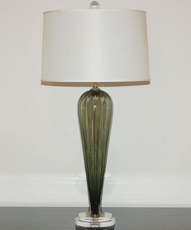 Exclusively blown for Swank Lighting by California artist Joe Cariati, these SAGE GREEN lamps are signed by the artist. Classic teardrop shape, with vertical ribs to provide optical surprise and add texture. 

The lamps measure 24 inches from