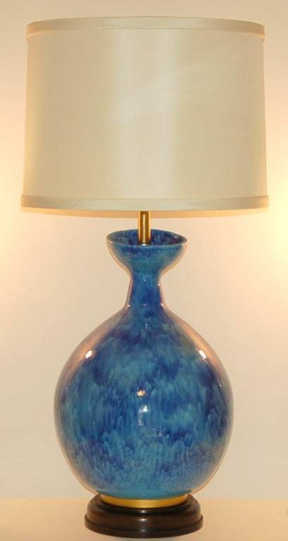 This is one enormous piece of Italian pottery, mounted on a classic Marbro base of mahogany and brass.  The organic design includes a wonderfully angled top.  So beautiful in MEDITERRANEAN BLUE.  A spectacular piece from the 1960's that looks as