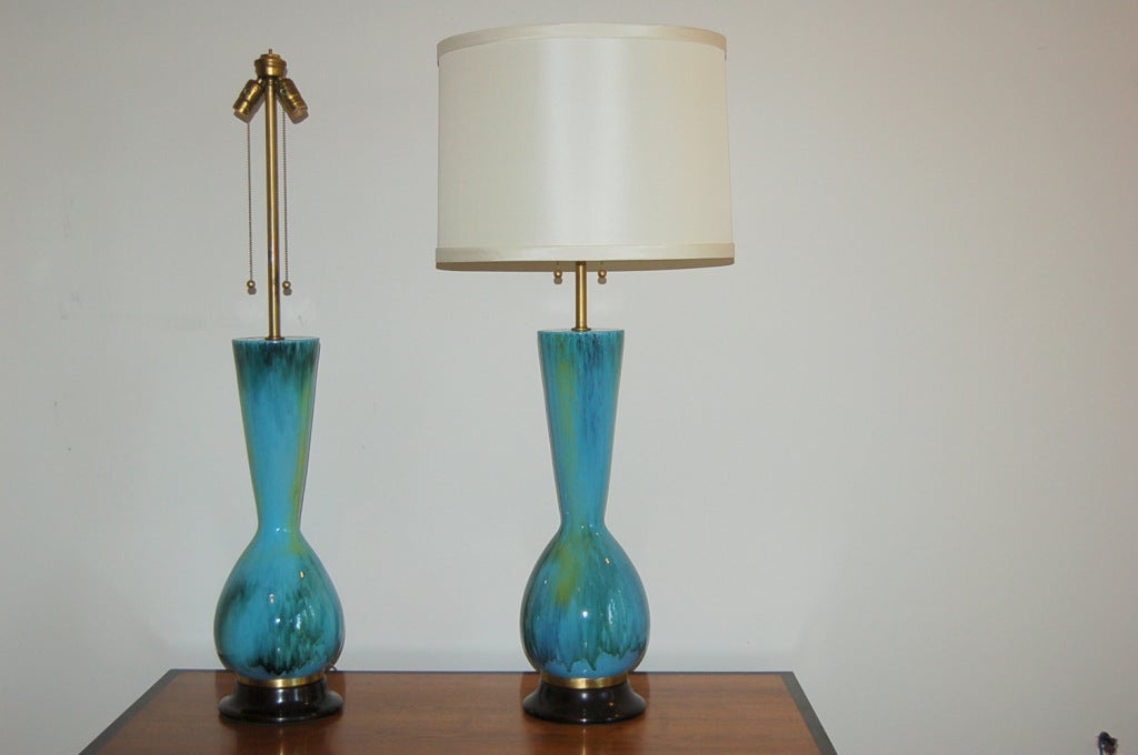 Outrageously large pair of Italian Cearmic lamps in shades of SEA BLUE and GRASS GREEN by The Marbro Lamp Company.  Mirror glazed finish with crackleure - dark brown wood bases with brass accents.

The lamps measure 42 inches from tabletop to