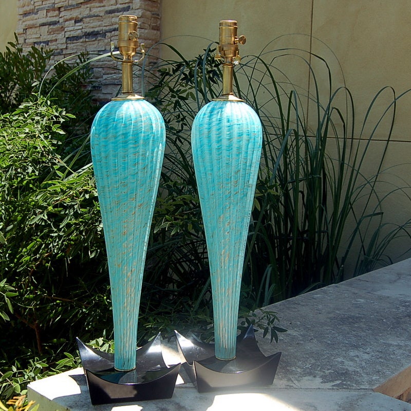 These TURQUOISE AND COPPER Murano lamps are spectacular!  The softly ribbed teardrops are simply stuffed with copper.  The Asian-style bases, original to the pair, have been relacquered in ebony.

They stand 27 inches tall to the top of the