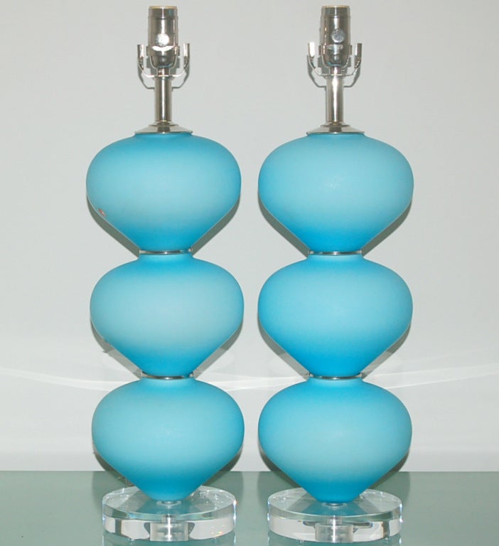 A simple grouping of three, like acrobatic Mentos, in SKY BLUE satin glass.  Wonderfully simple and stylish!

The lamps stand 24 inches high from tabletop to socket top.  As shown, the top of shade is 30 inches high.  Lampshades are for display