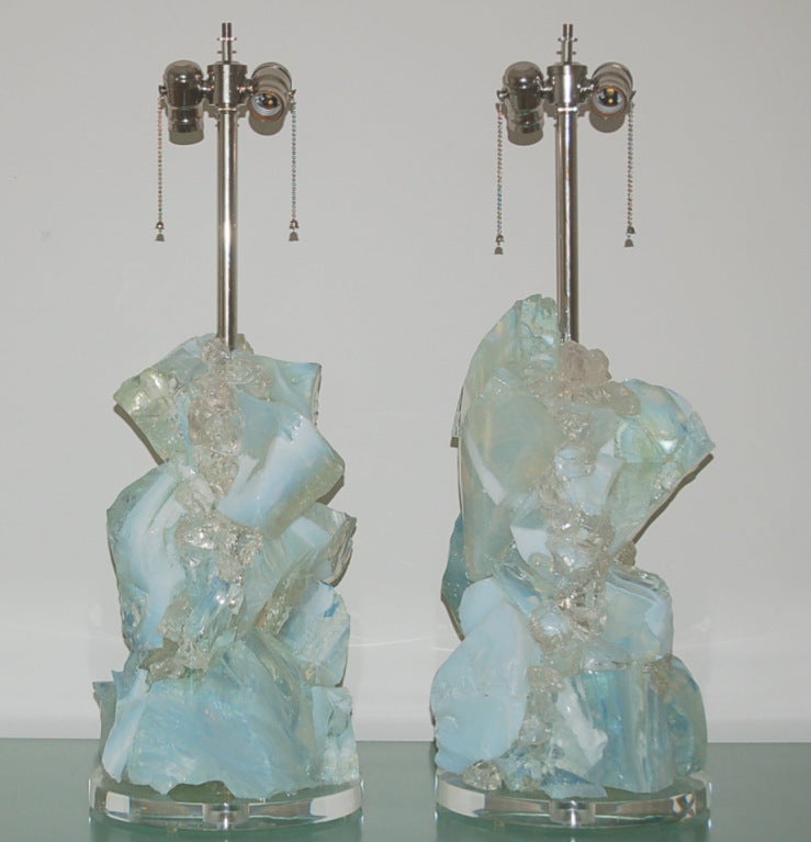 These scultped glass cluster lamps in WHITE OPALINE are from the ROCK CANDY Lighting Collection at Swank Lighting.  The glass has a wonderful soft blue cast to it and really glows when the light hits it! 

The lamps are made of large chunks of
