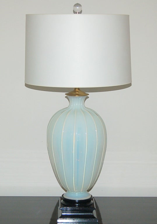 Statuesque and stunning!   Creamy WHITE OPALINE Murano glass lamps from Marbro that read as SOFT BLUE.   If you follow our products, you know that the lead blown into this glass gives it a magical glow.  These are gorgeous!

Beautifully based on