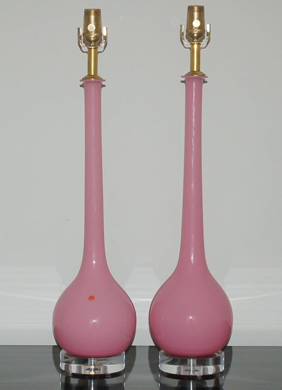 The color of these lamps is simply dreamy!  Sleek pair of vintage Murano lamps in BUBBLE GUM with long slender necks, by Archimede Seguso.  We show these with nickel plated hardware, mounted on simple Lucite bases.

The lamps measure 27 inches
