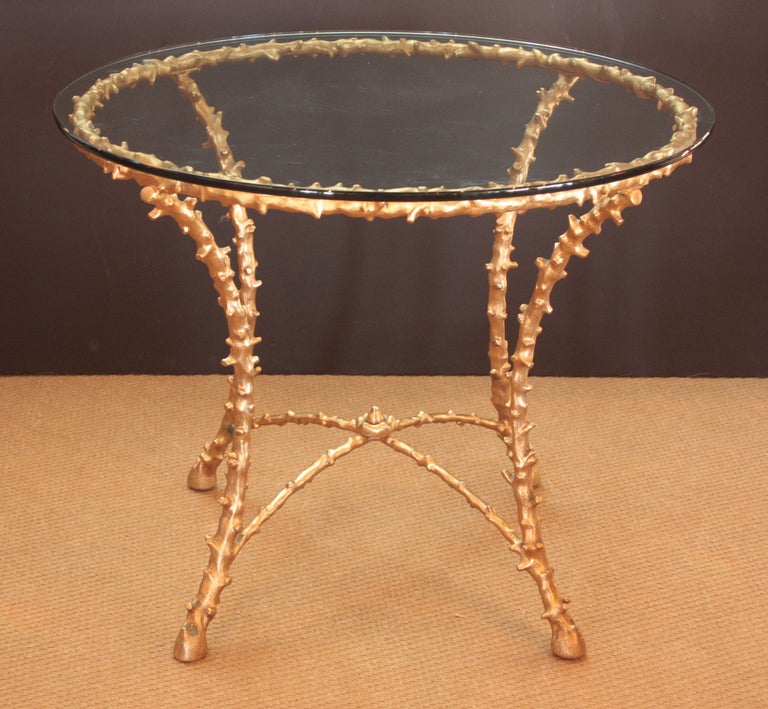 a circa 1960 round occasional table with gold painted faux branches terminating in hoof feet, from the Highland Park estate of interior designer / art dealer Eugene Frazier

author of Good Taste Begins with You, 1969