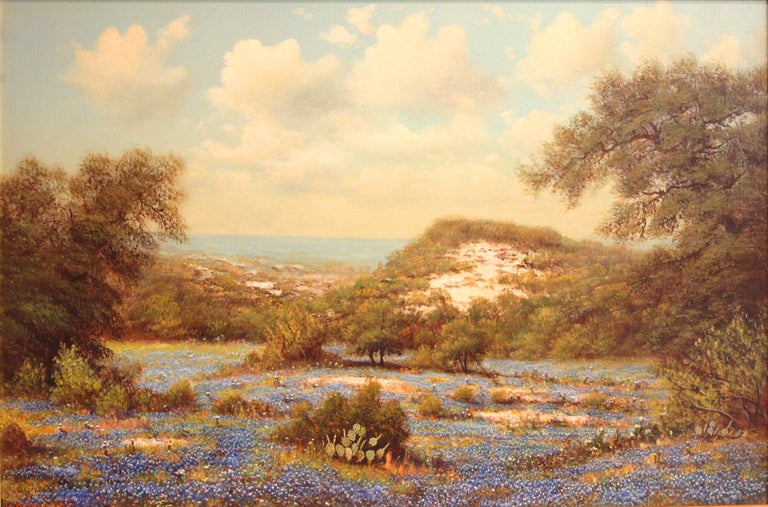 a landscape with hills, trees, fields of bluebonnets and some cacti by W. R. Thrasher