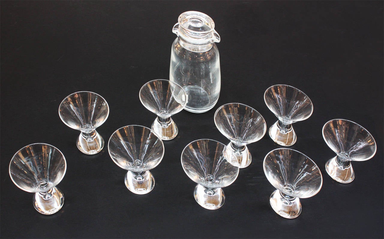 a group of nine (9) teardrop cocktail / martini glasses, designed by Steuben's George Thompson in 1950, with tall lidded Steuben shaker

glasses 4