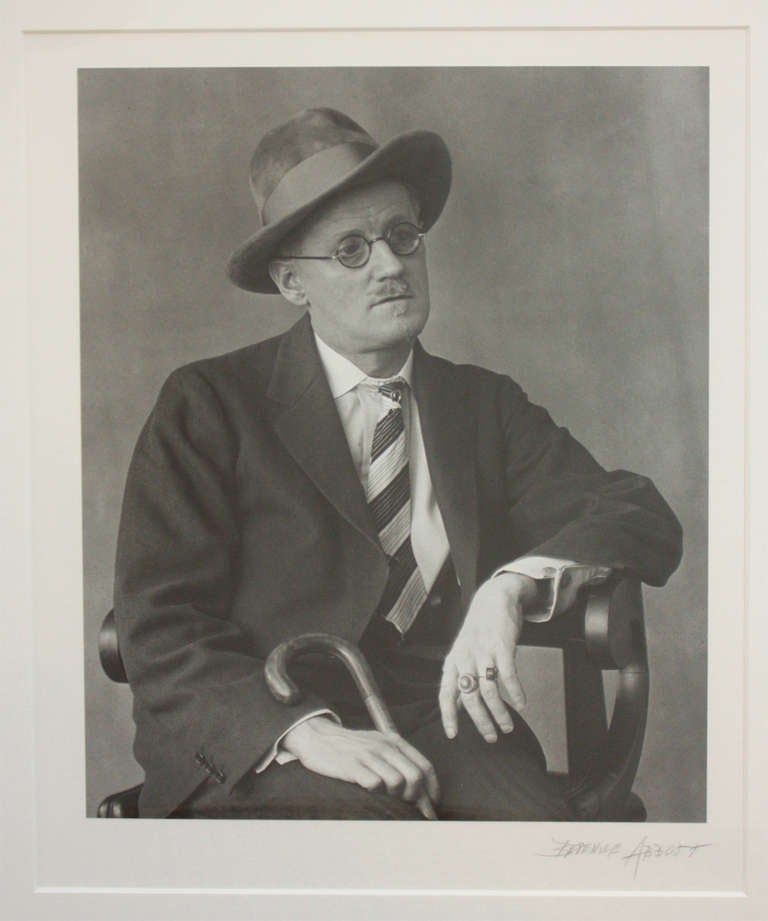 a matted and framed black and white photo of author James Joyce signed lower right by American photographer Berenice Abbott (1898-1991)